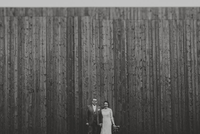 wedding in co meath by sligo wedding photographer, couple at the wooden wall