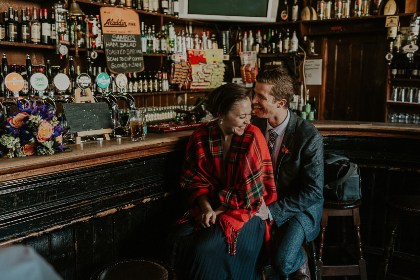 elopement-enjoying-guinness-in-old-irish-pub