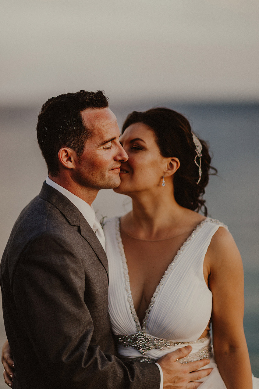 bride and groom portrait in warm soft sunset light 