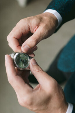 01-Groom putting his rolex watch on at adare manor 9
