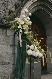 floral arrangements in front of the church, white and green colour palettes