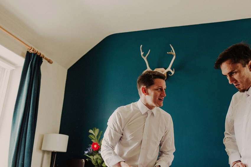 Great timing with the horns on the wall. Groom looks like he's having horns