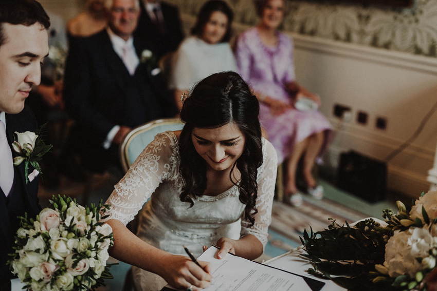 Grainne is signing the registery form