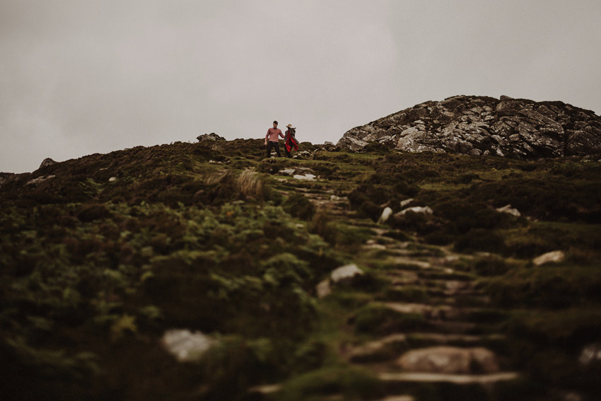 couple is walking down the stone stairs