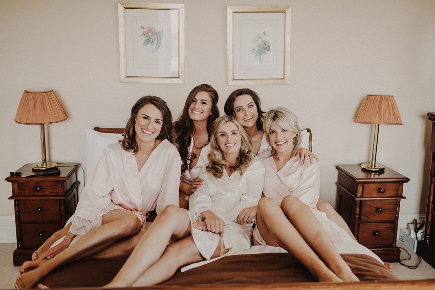 bride and girls on the bed in ballintaggart house