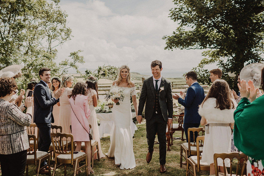 very handsome couple is doing exit after vows