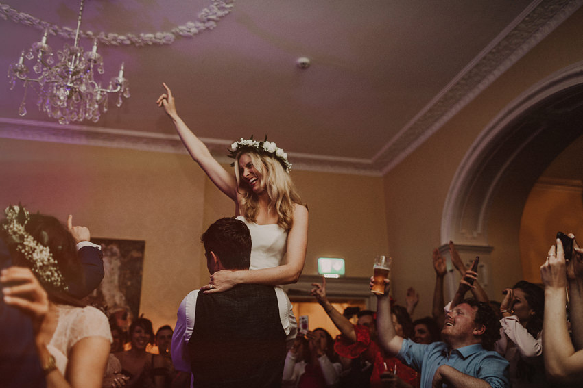 epic first dance at the wedding groom lifts bride