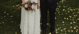 The millhouse slane wedding and slideshow - roisin and Sean standing under the tree with fallen apples around them